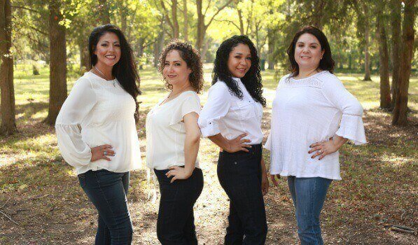 Dallas oral surgery team members in white shirts outdoors